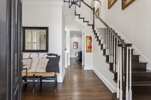 Welcoming, light filled foyer with solid wood hardwood floors