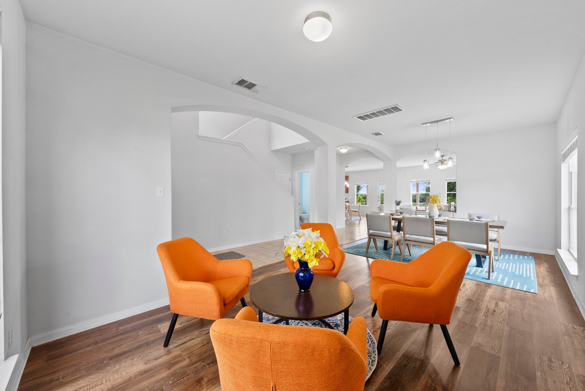 One of three living rooms that's at the front of the house, and the formal dining room.