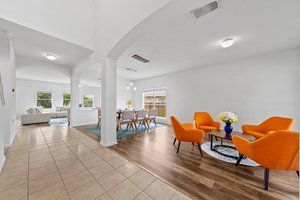 s you walk into the front door, the first living room and the formal dining room are on your right.