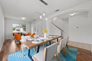 The formal dining room and one of three living areas at the front of the house.
