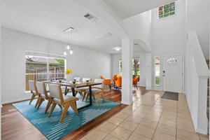 The formal dining room and one of three living areas at the front of the house.