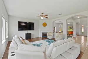 The main living area at the back of the house has a wall of windows looking out into the community pond. No back neighbors!