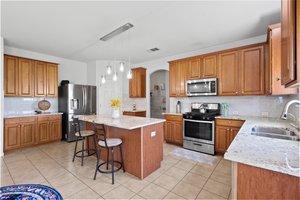 Beautiful kitchen with lots of cabinetry and a walk-in pantry.