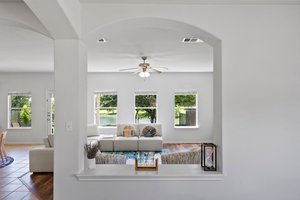 he main living area at the back of the house has a wall of windows looking out into the community pond. No back neighbors!