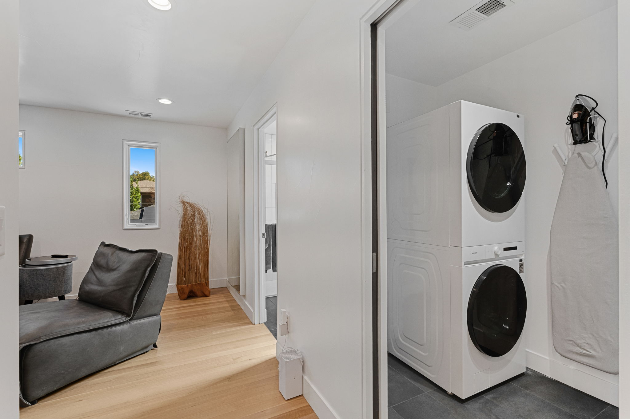 The laundry room has a hub and room for storage