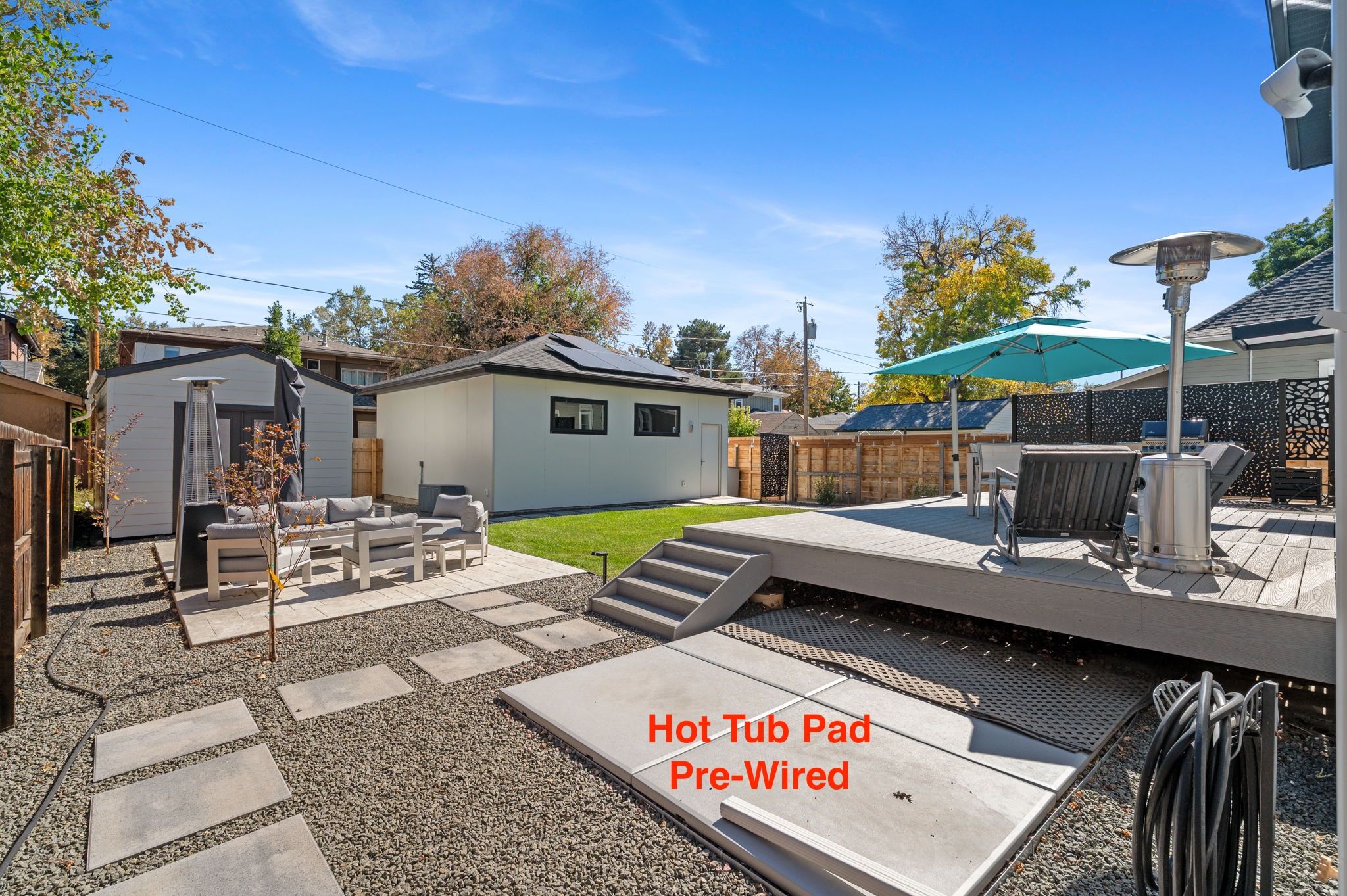 Multiple seating areas, she-shed or man-cave, gardening/tool shed, ready for a hot tub, and an oversized 2-car garage
