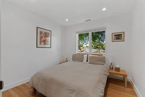 The junior bedroom on the upper level with mountain views