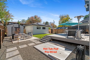 Multiple seating areas, she-shed or man-cave, gardening/tool shed, ready for a hot tub, and an oversized 2-car garage