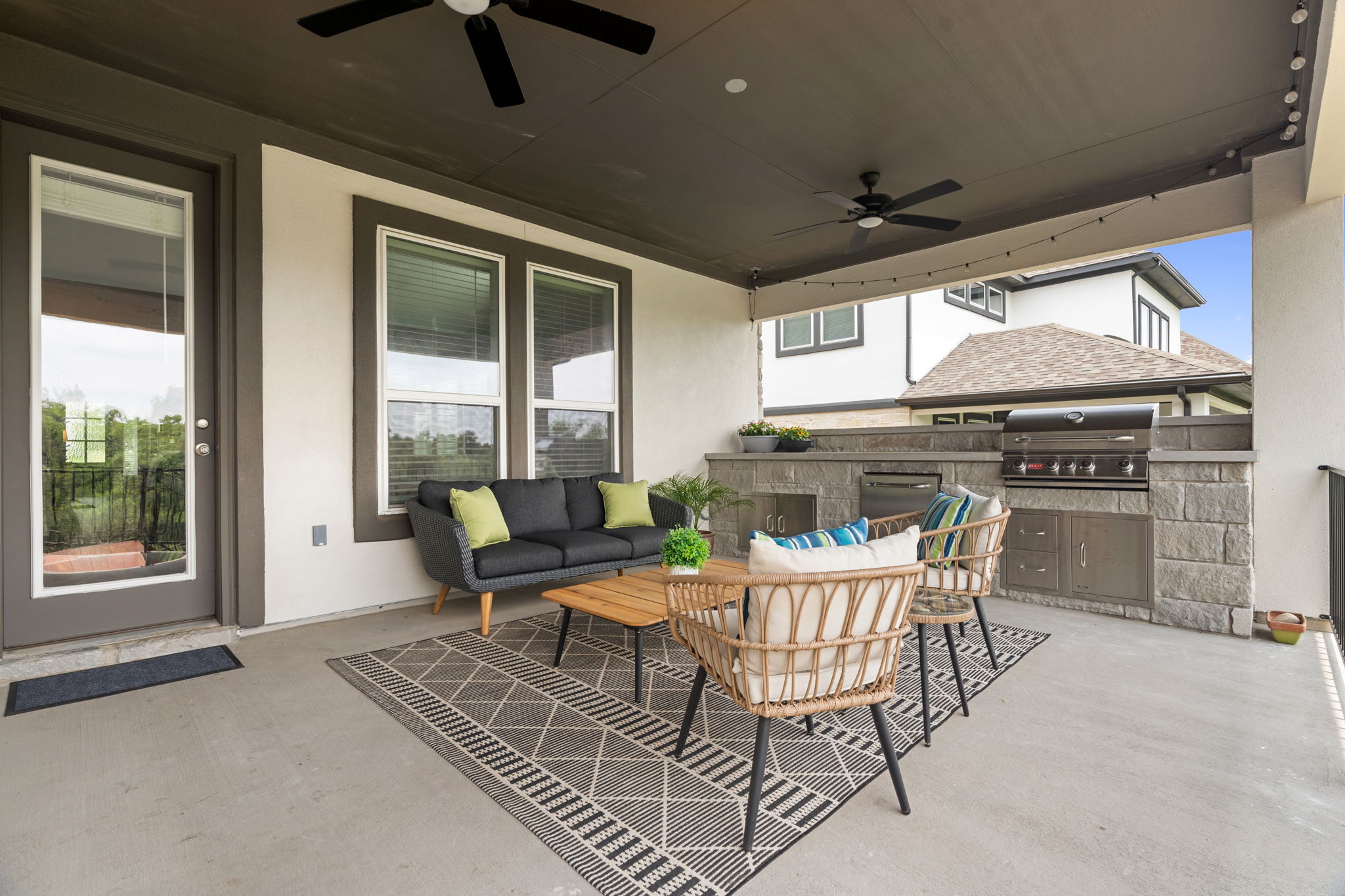 The outdoor kitchen was added by the owners after construction, which added function and privacy to the outdoor space.