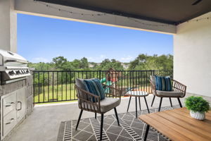 The covered patio is elevated giving great views of the greenbelt.