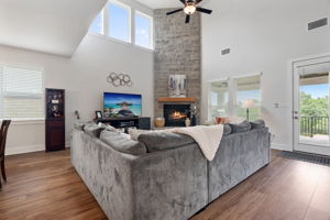 The upgraded stone fireplace is the focal point and warms up the space.