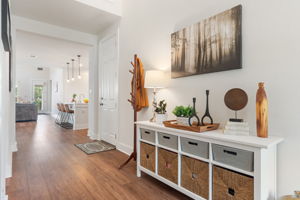 The wide entry hallway and vaulted ceiling make a grand statement upon entry.