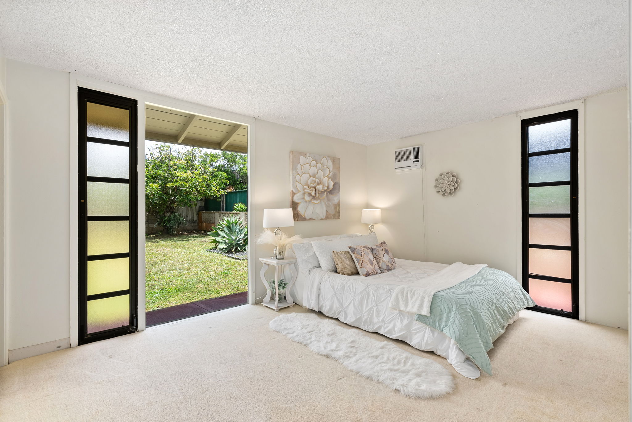 Primary Bedroom with view of backyard