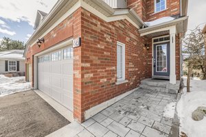 Professionally landscaped front walkway & gardens