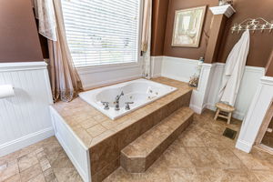 Alcove jetted tub.