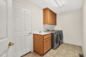 Spacious full laundry room. Leads to garage.