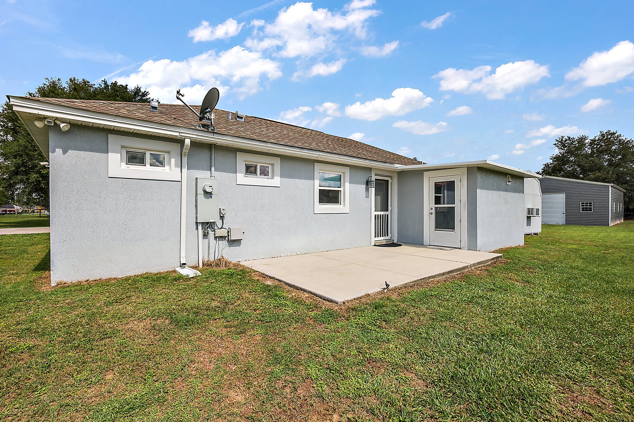 Second Home Rear Patio with Door to Interior Laundry Room