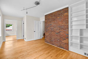 Exposed Brick Wall and Built In Shelving