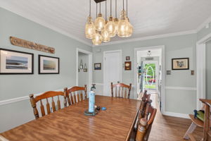 Seamless flow between kitchen, dining, and living spaces.