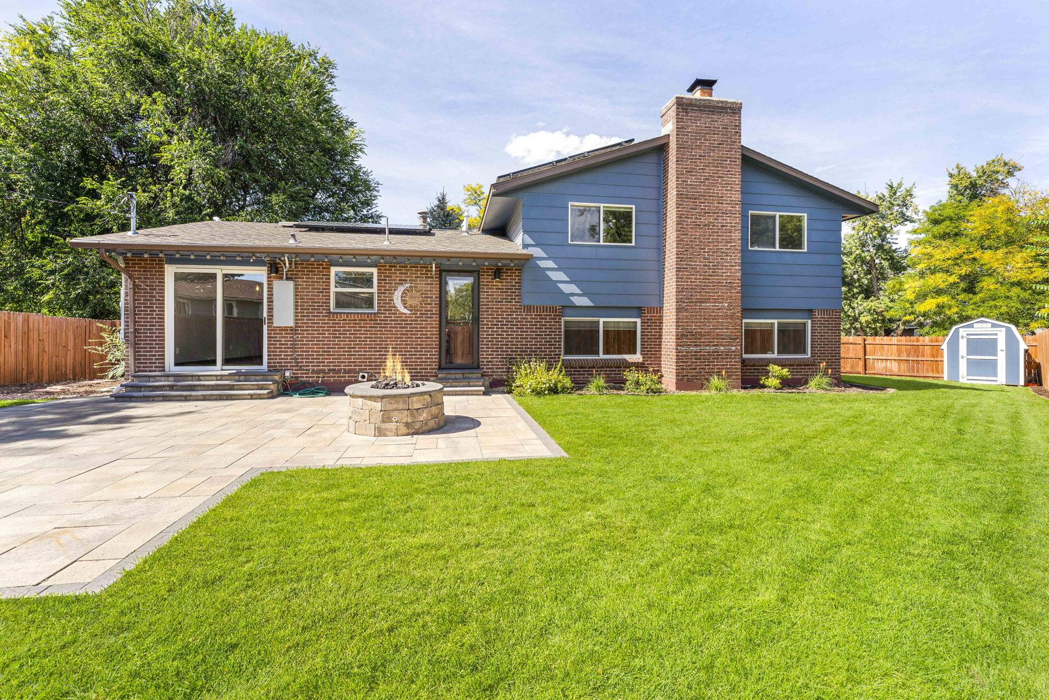 Spacious Backyard with Paver Patio & Firepit