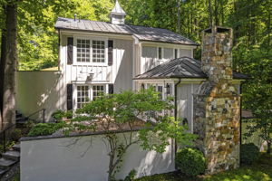 Charming stucco walls and stone fireplace