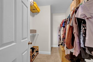 1 of 2 walk-in closets in primary