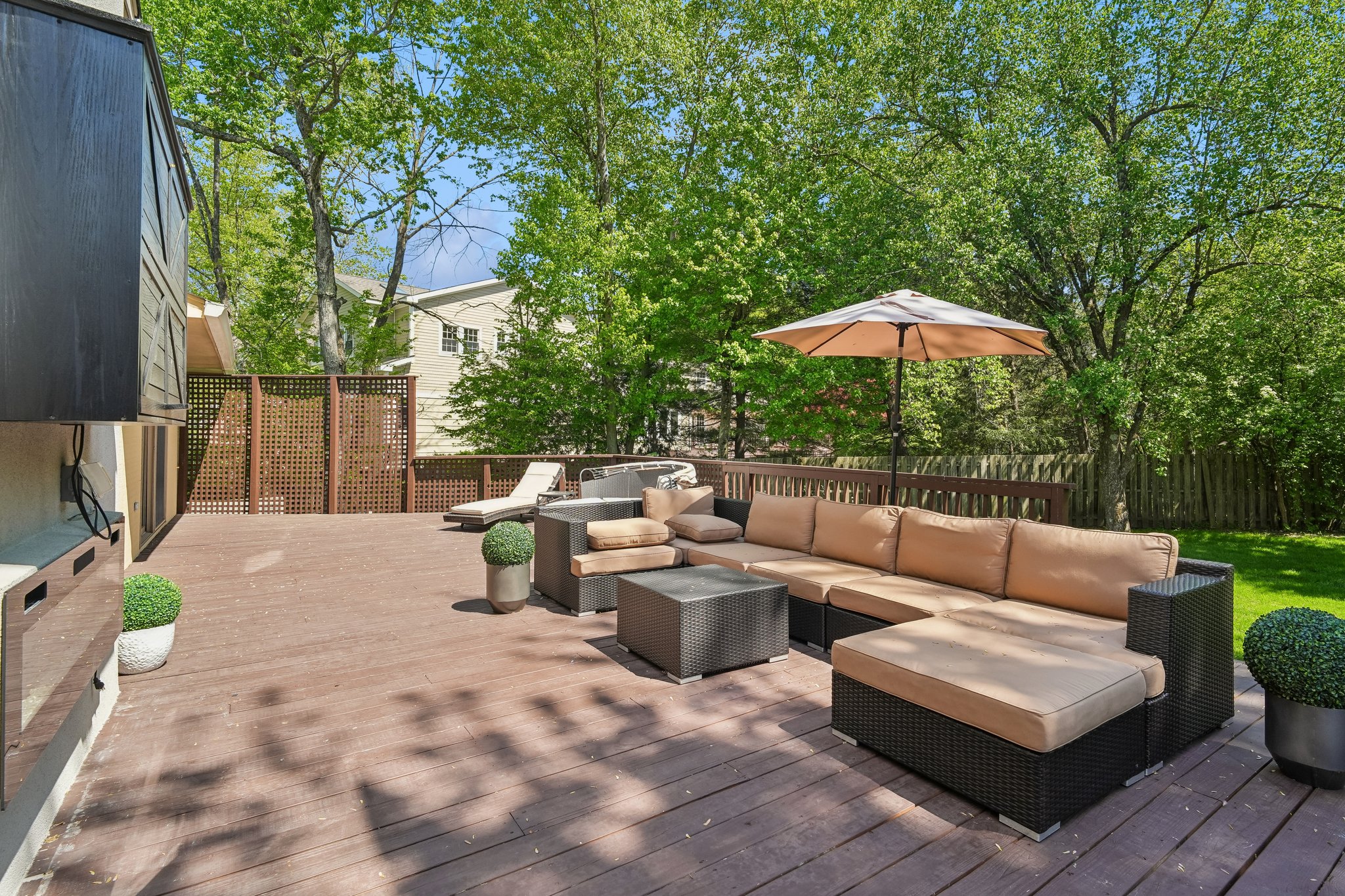 The large space on the deck allows for an oversized sectional providing plenty of seating for watching TV or entertaining.