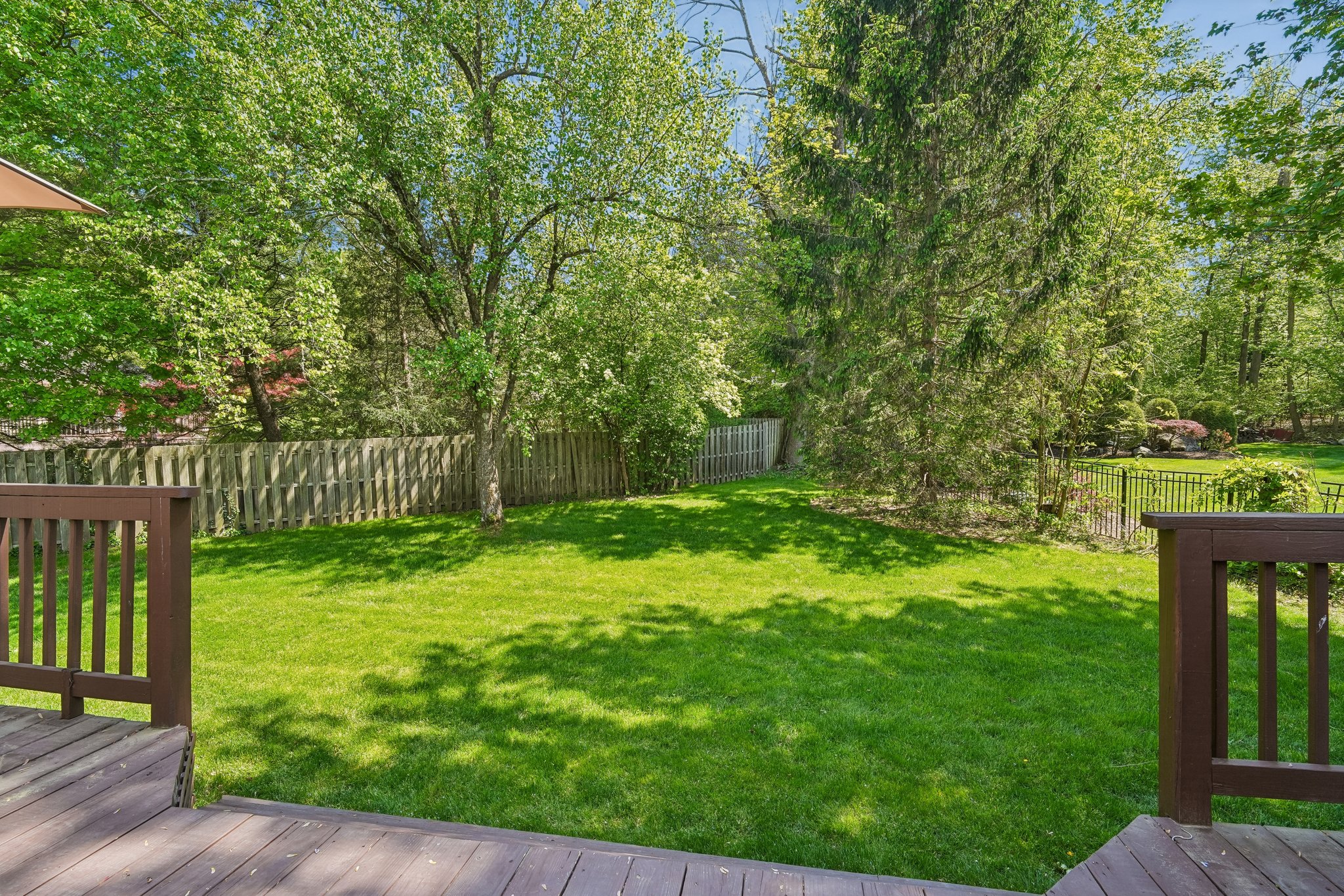 Experience the luxury of space with this level, green oasis. From the garden parties to the quiet mornings in the sun, this well maintained backyard serves as the perfect backdrop for your outdoor vision.