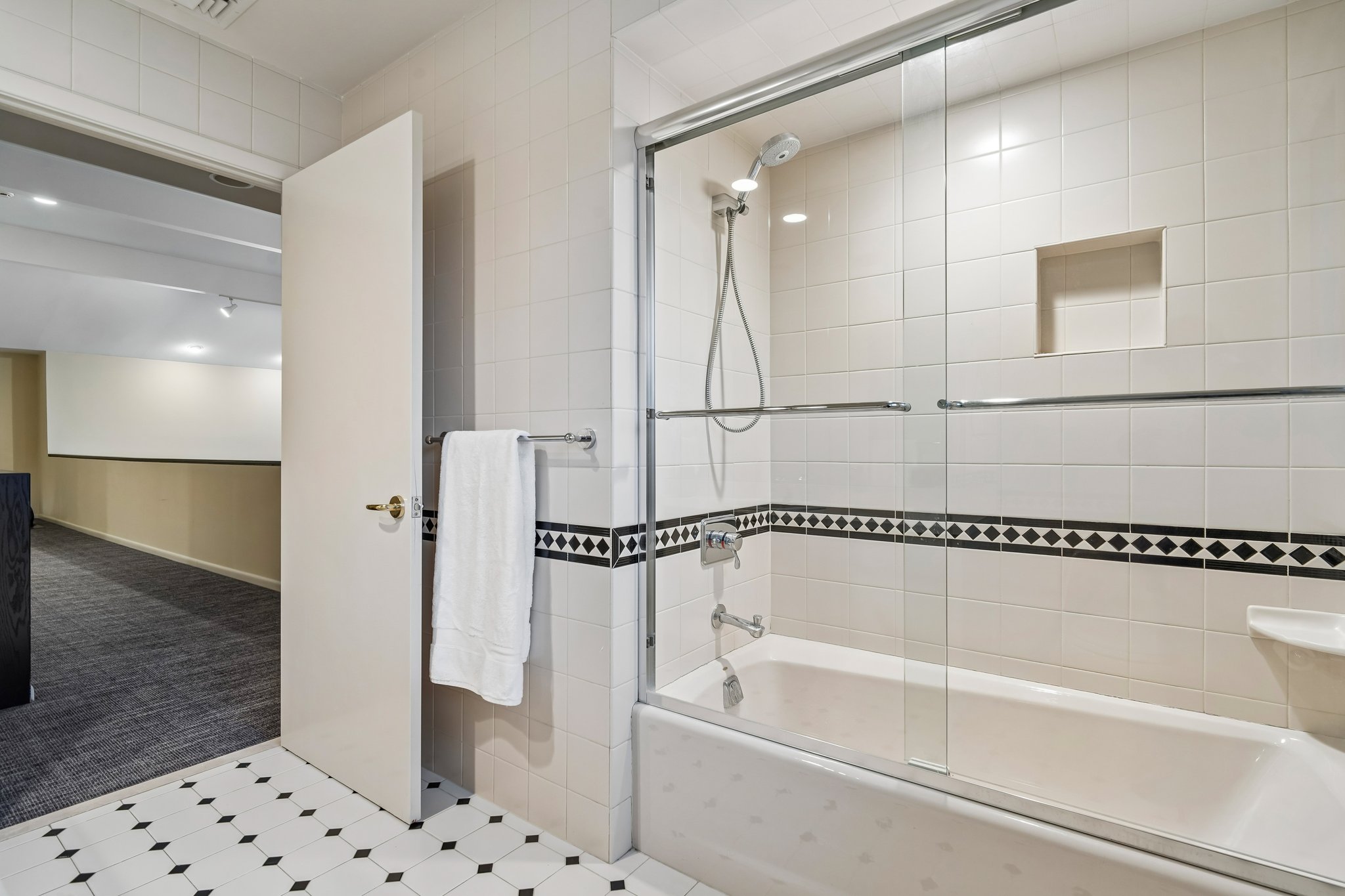 Another view of the first of two second floor hall baths with tub-over shower.