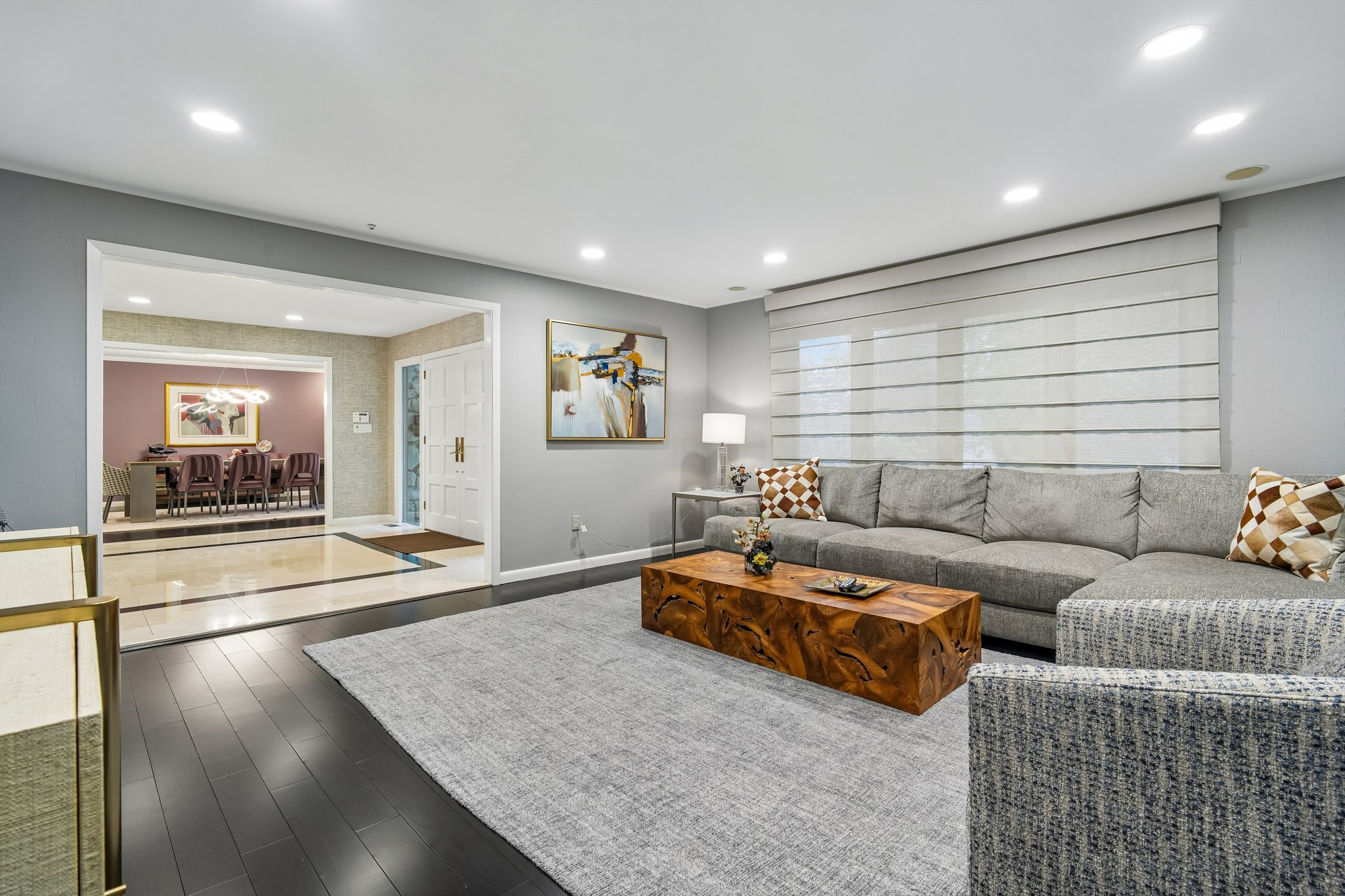 Family room with a wall of glass windows.