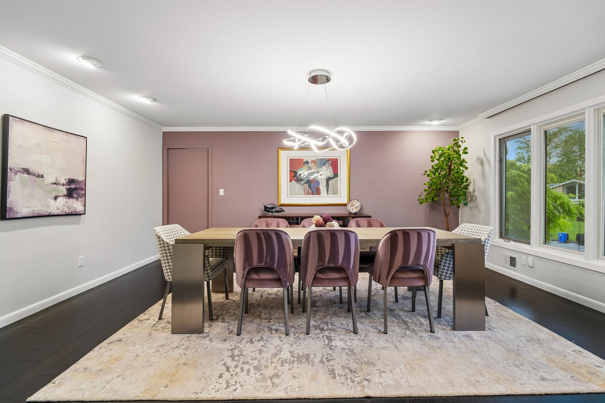The formal dining room features a storage closet, offering space for home organization.