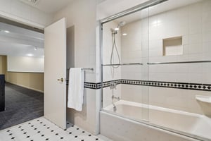 Another view of the first of two second floor hall baths with tub-over shower.