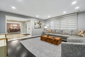 Family room with a wall of glass windows.