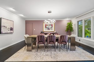 The formal dining room features a storage closet, offering space for home organization.