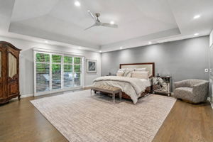 A stunning primary bedroom sanctuary with high ceilings and seamless access to the outdoors. The beautiful ensuite bathroom rivals any designer spa, complete with a dedicated make-up vanity, custom cabinetry with double sinks and a spectacular oversized shower, and two huge walk-in closets - perfect for a peaceful start to your day.
