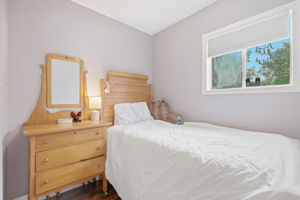 Door in this room accesses attic space for additional storage area