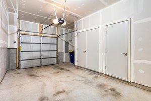 Utility closet in garage along w/lg storage room