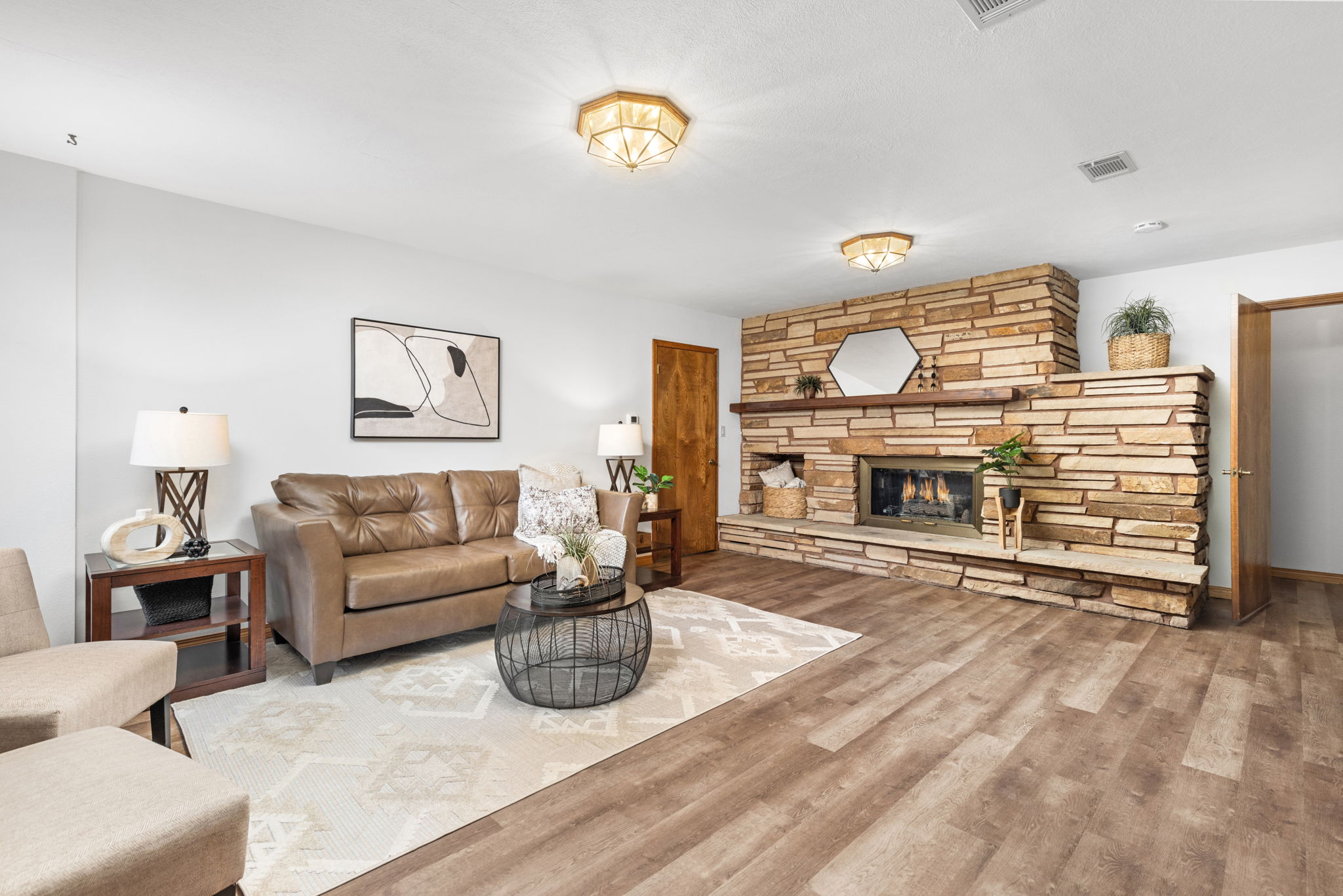 The Family Room Has a Second Stone Fireplace