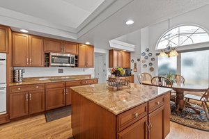 Spacious Kitchen with cherry cabinets and granite counters