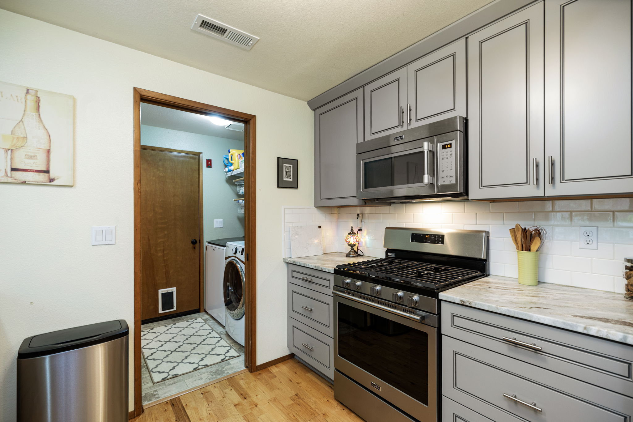 to laundry, half bath & garage