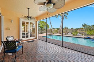 Roofed/Screened Patio accessible from the Family Room and Owner's Suite