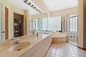 Prmary bathroom: dual sink vanity, roman tub, separate shower, private bidet & toilet