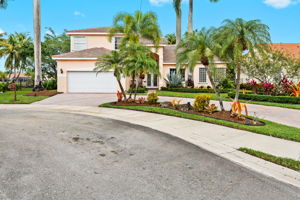 Extra long circular drive for extra parking. 10-yr young roof, full Accordion Shutters plus Impact Front & Garage doors.