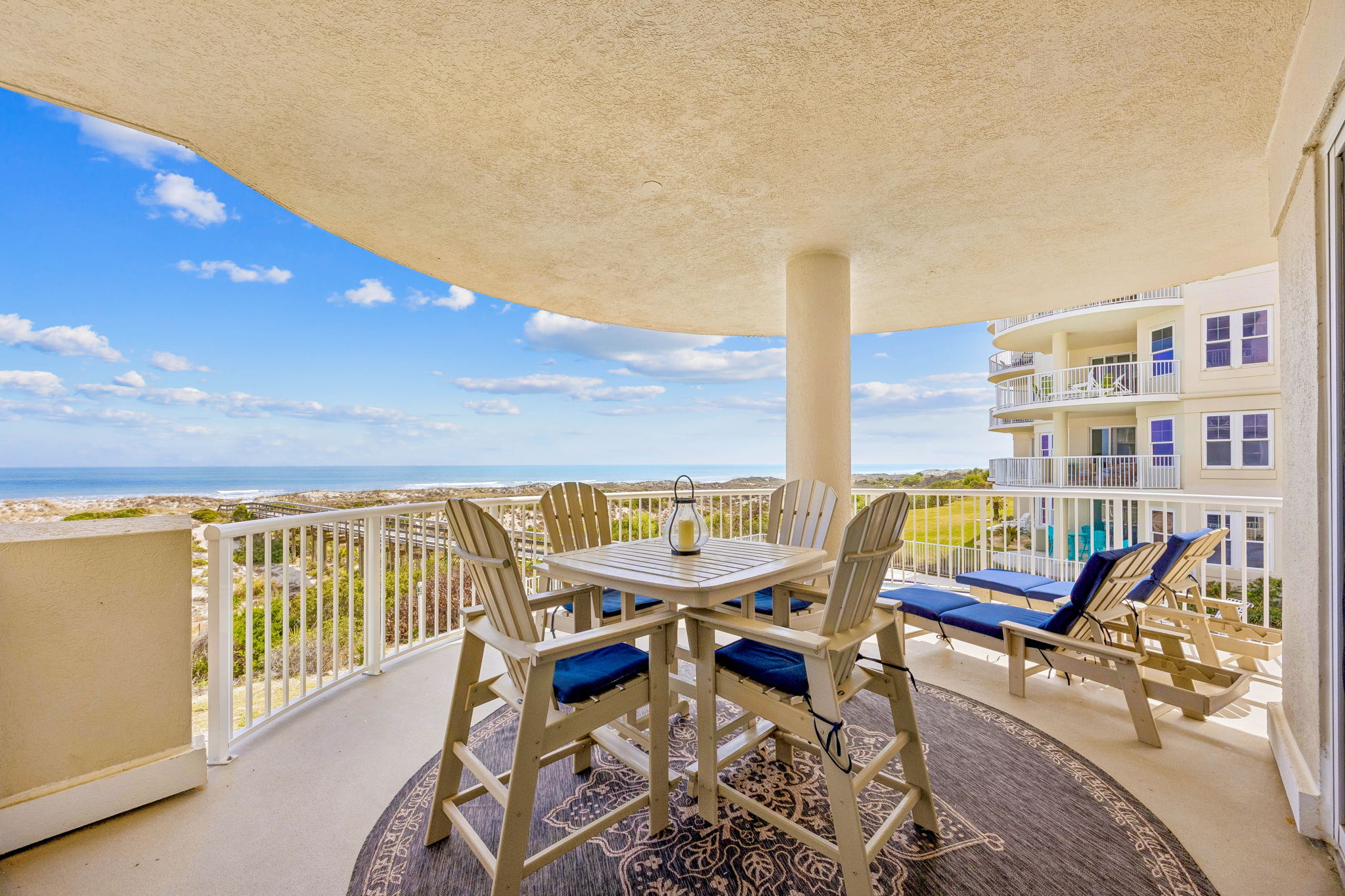 ... beginning with an oversized wraparound balcony designed for dining, lounging, and taking in the coastal breeze.