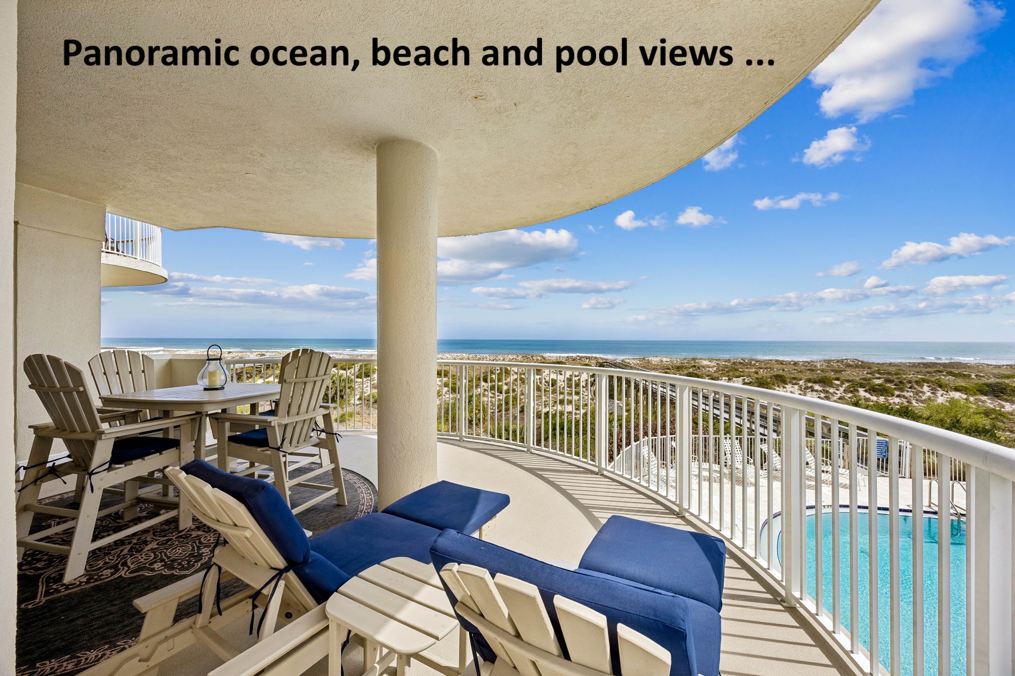 Panoramic ocean, beach, and pool views unfold from this inviting outdoor living space ...
