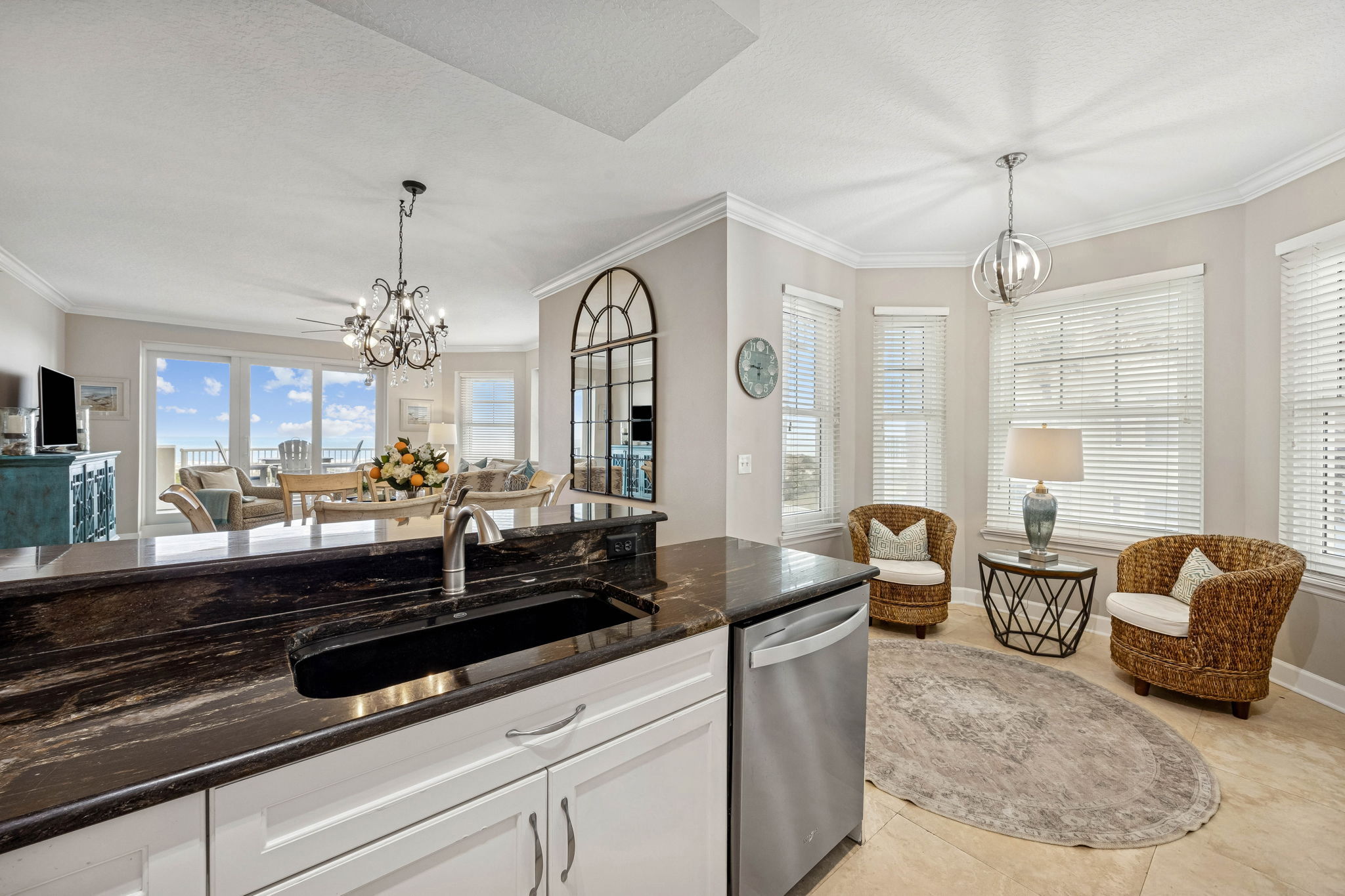 Just off the kitchen, a window-wrapped breakfast nook adds flexibility to the floor plan ...