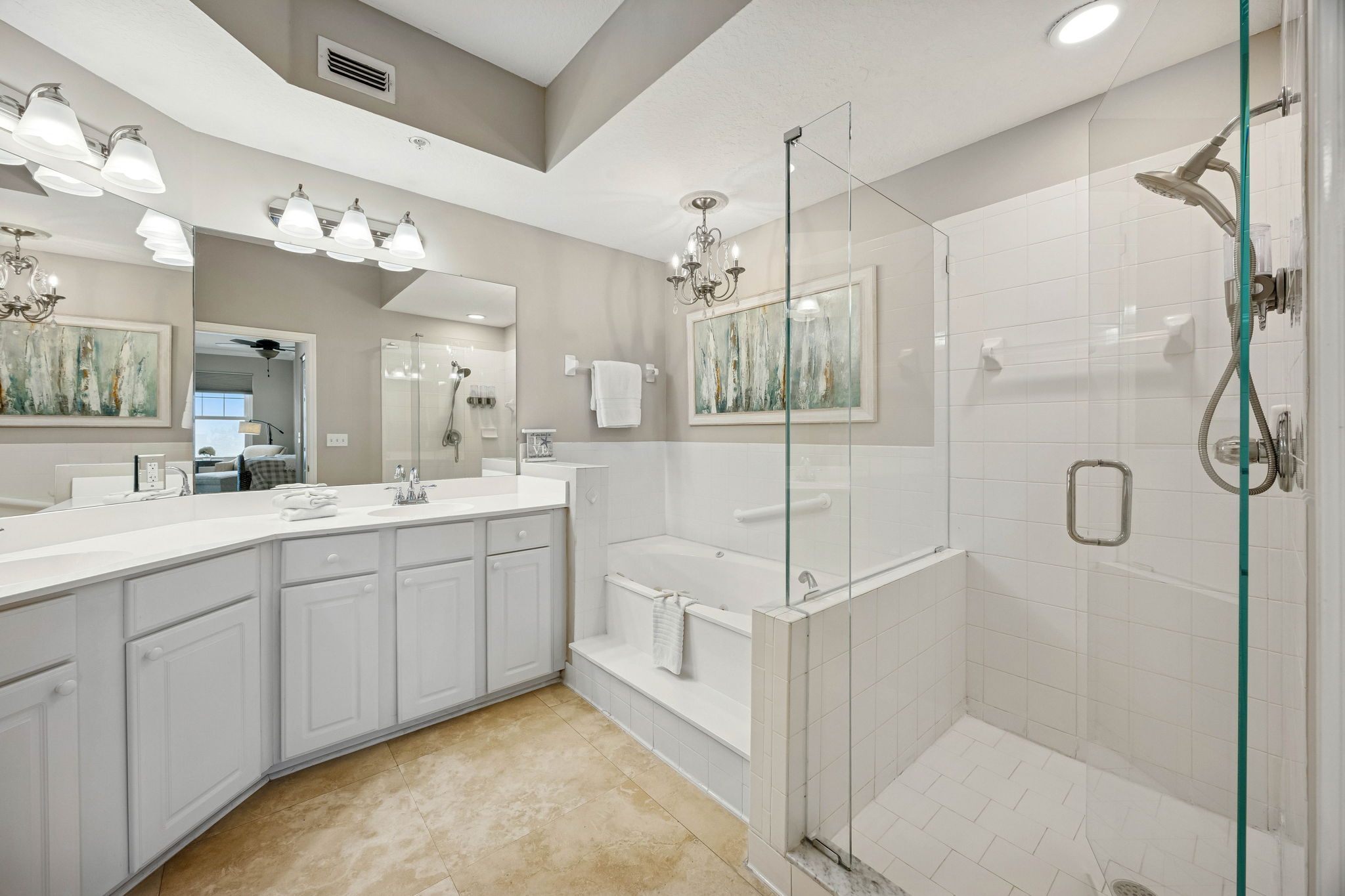 The ensuite bath is bright and generously sized ...