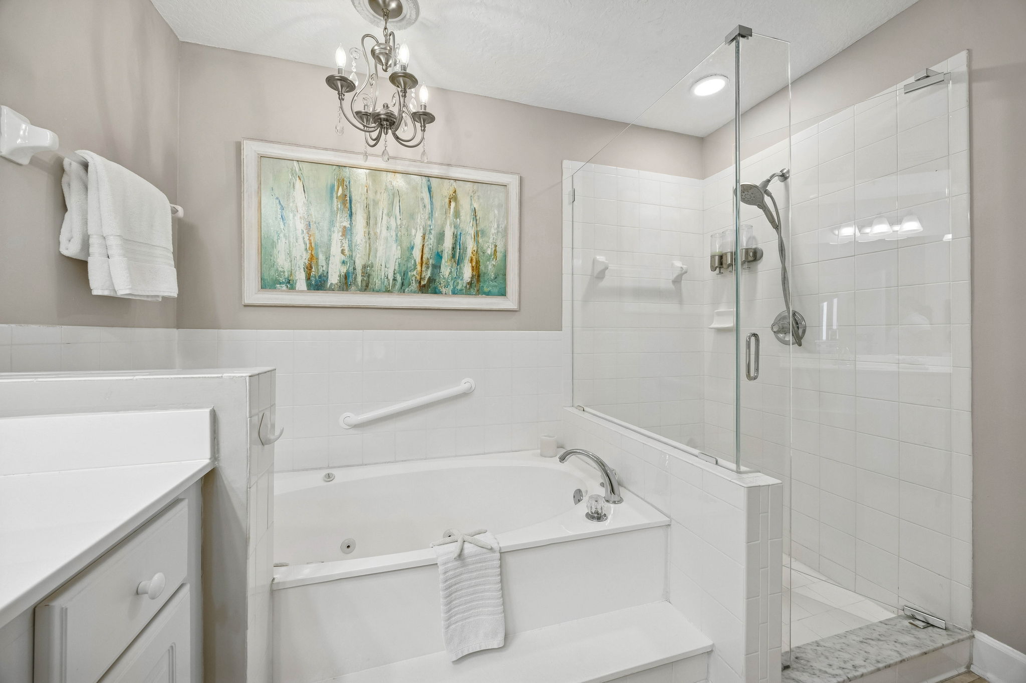 ... with a soaking tub and a recently renovated frameless shower.