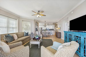 The open layout connects living, dining, and kitchen spaces with ease ...