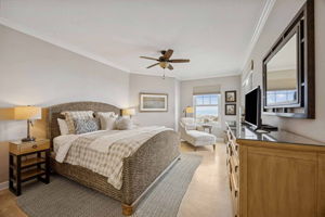 The primary suite offers a generous footprint and a seamless connection to the balcony beyond ...